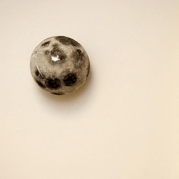 Tunglið er spegill sculpture by Olafur Thordarson 2012,  Papier-maché and aluminum paint, 20x18x20 cm